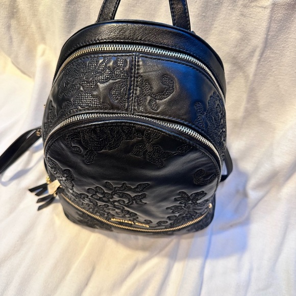 Michael Kors black soft leather embossed backpack. - Picture 3 of 4